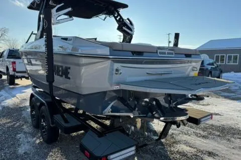 Slide: The Image of 2026 Supreme S220 boat on trailer, parked on snowy ground, rear view. - 5