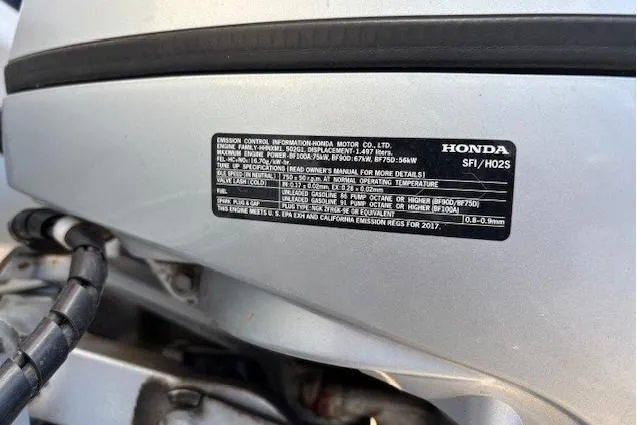 Slide: The Image of Honda engine label on a 2003 Boston Whaler 170 Montauk boat. - 8