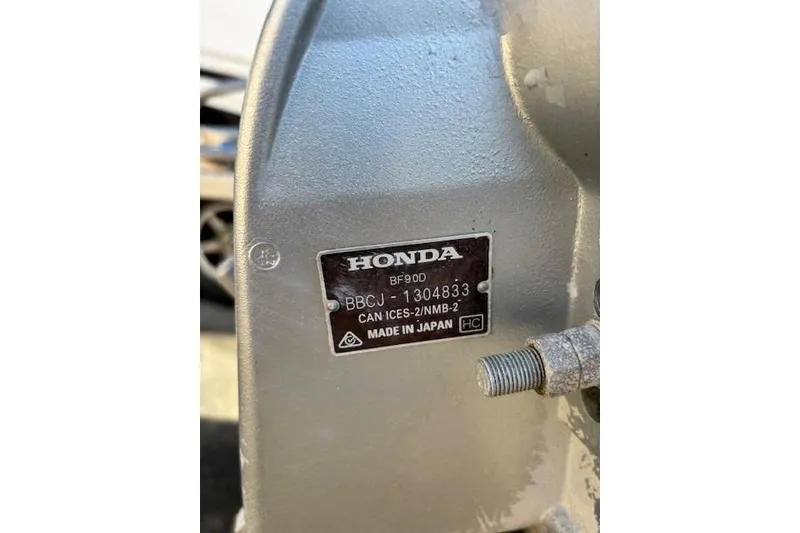 Slide: The Image of Honda BF90D engine label on a 2003 Boston Whaler 170 Montauk boat. - 9