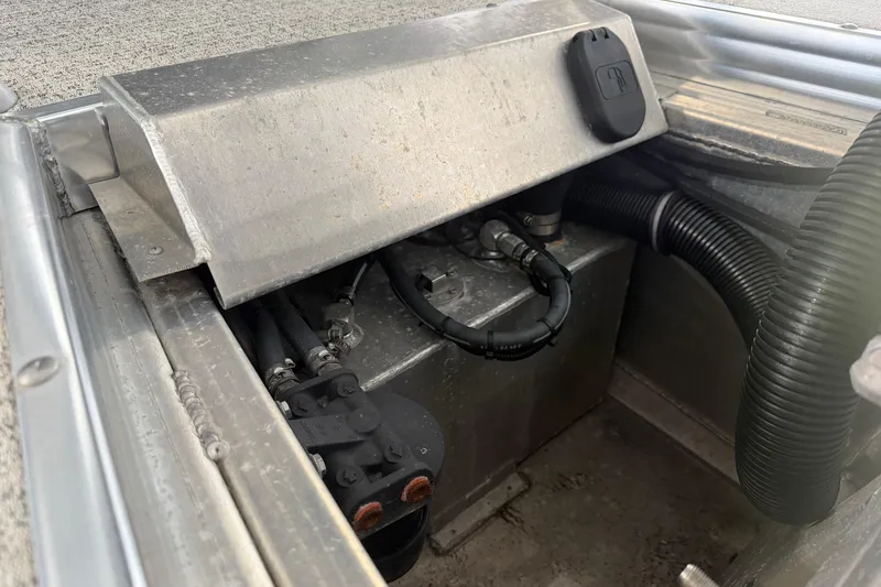 Slide: The Image of 2023 Aloha Pontoon PS 260 TT engine compartment with visible wiring and components. - 22