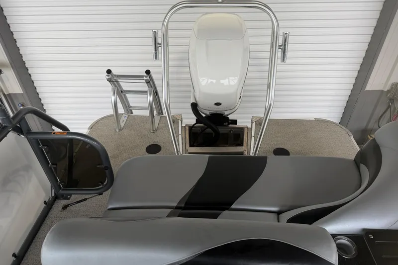 Slide: The Image of 2023 Aloha Pontoon PS 260 TT interior with seating and motor view. - 30