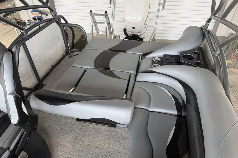 Slide: The Image of 2023 Aloha Pontoon PS 260 TT interior with sleek gray seating and cup holders. - 31
