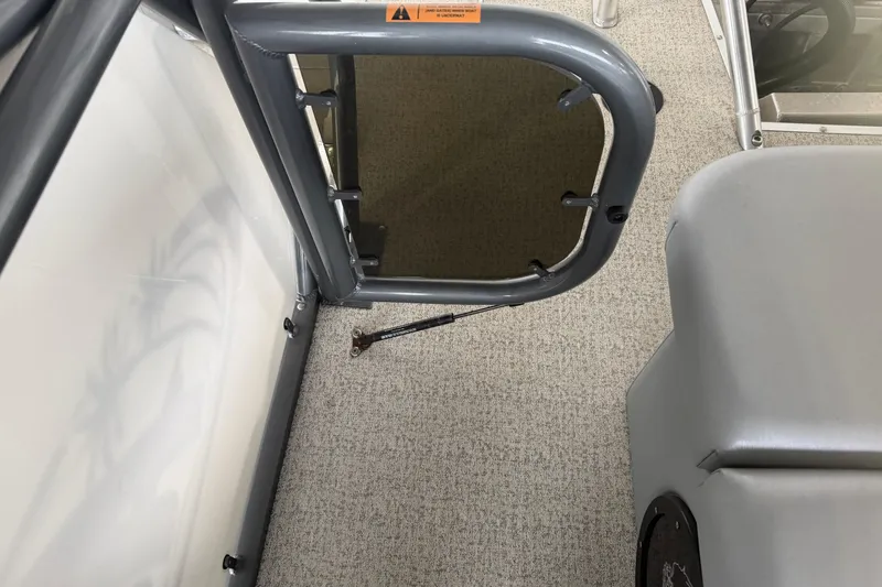 Slide: The Image of 2023 Aloha Pontoon PS 260 TT interior with open gate and carpeted floor. - 36