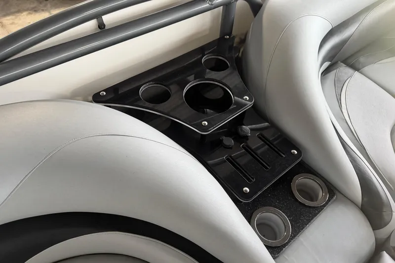 Slide: The Image of Interior of 2023 Aloha Pontoon PS 260 TT with cup holders and sleek seating. - 38