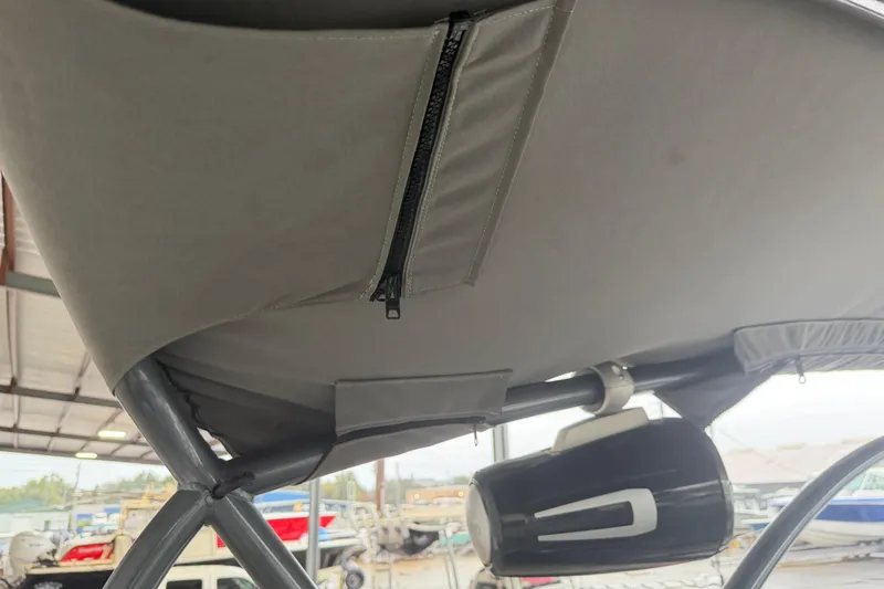 Slide: The Image of 2023 Aloha Pontoon PS 260 TT canopy with zipper and speaker detail. - 45