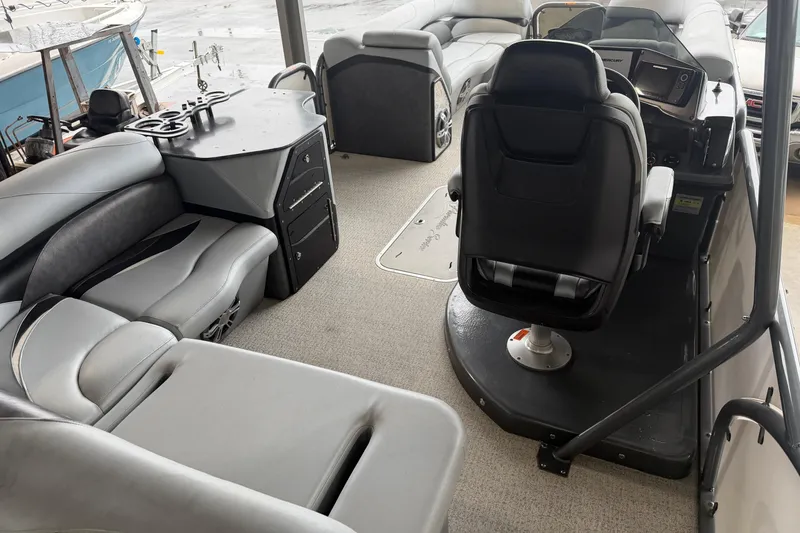 Slide: The Image of 2023 Aloha Pontoon PS 260 TT interior with seating and helm station. - 46