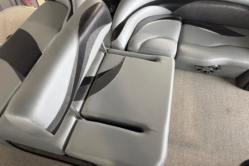 Slide: The Image of 2023 Aloha Pontoon PS 260 TT interior with sleek gray seating and modern design. - 48