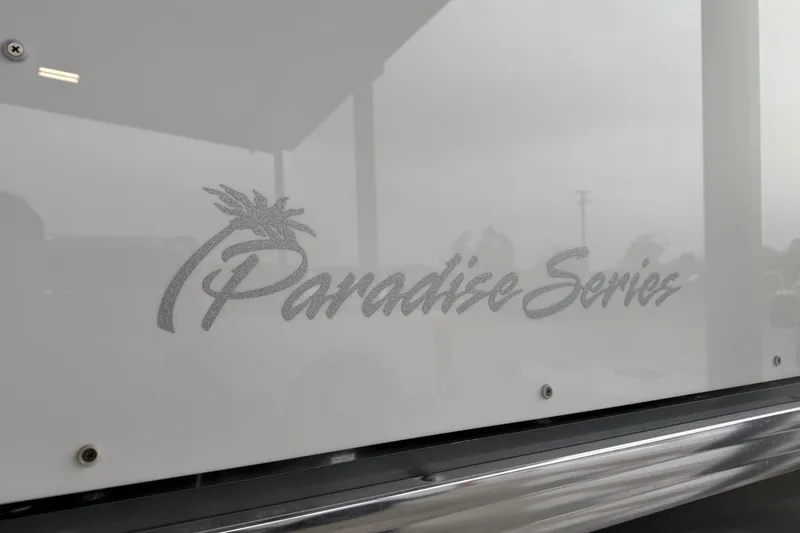 Slide: The Image of 2023 Aloha Pontoon PS 260 TT, Paradise Series logo on sleek white surface. - 5