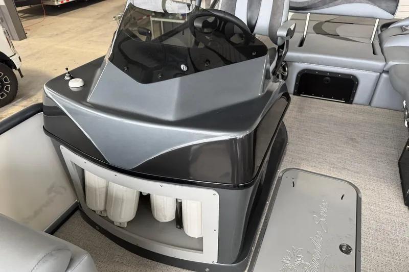 Slide: The Image of 2023 Aloha Pontoon PS 260 TT interior with sleek console and seating. - 55
