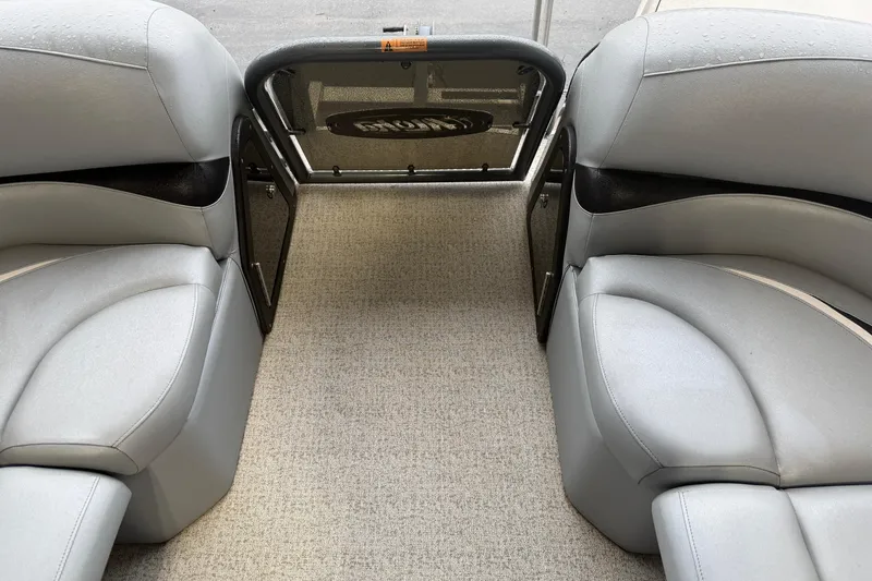 Slide: The Image of Interior of 2023 Aloha Pontoon PS 260 TT with gray seating and carpet flooring. - 58
