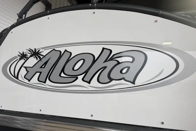 Slide: The Image of 2023 Aloha Pontoon PS 260 TT logo with palm tree design. - 6