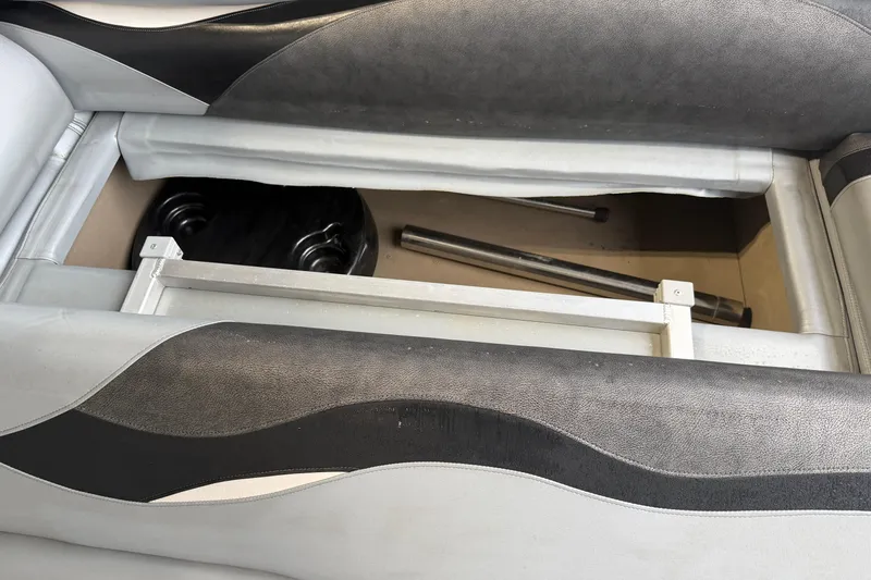 Slide: The Image of Storage compartment of 2023 Aloha Pontoon PS 260 TT with visible metal components. - 60