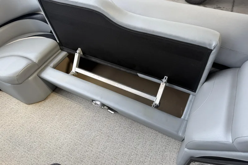 Slide: The Image of Open storage compartment in 2023 Aloha Pontoon PS 260 TT boat seat. - 66