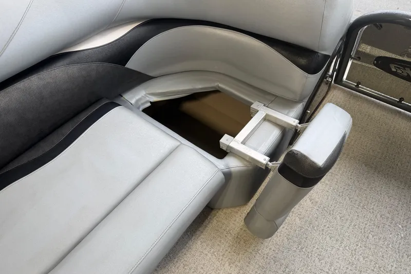 Slide: The Image of 2023 Aloha Pontoon PS 260 TT seat with storage compartment open. - 69
