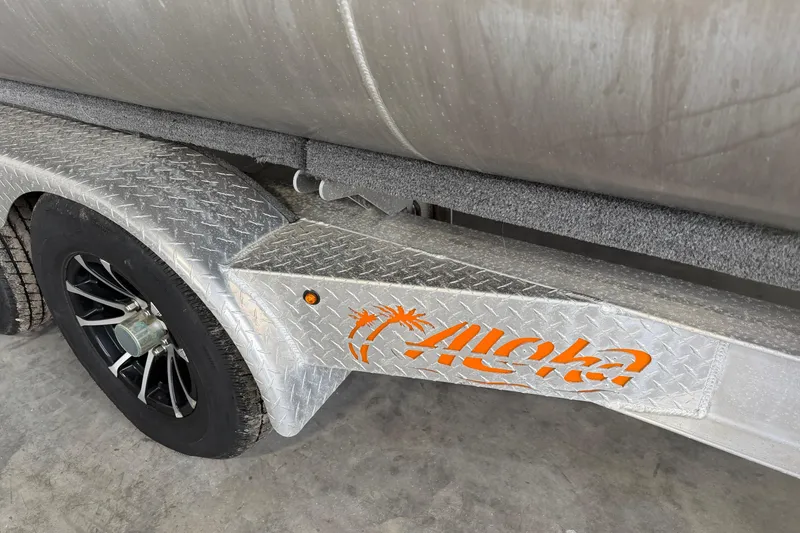 Slide: The Image of 2023 Aloha Pontoon PS 260 TT trailer with diamond plate and logo detail. - 7