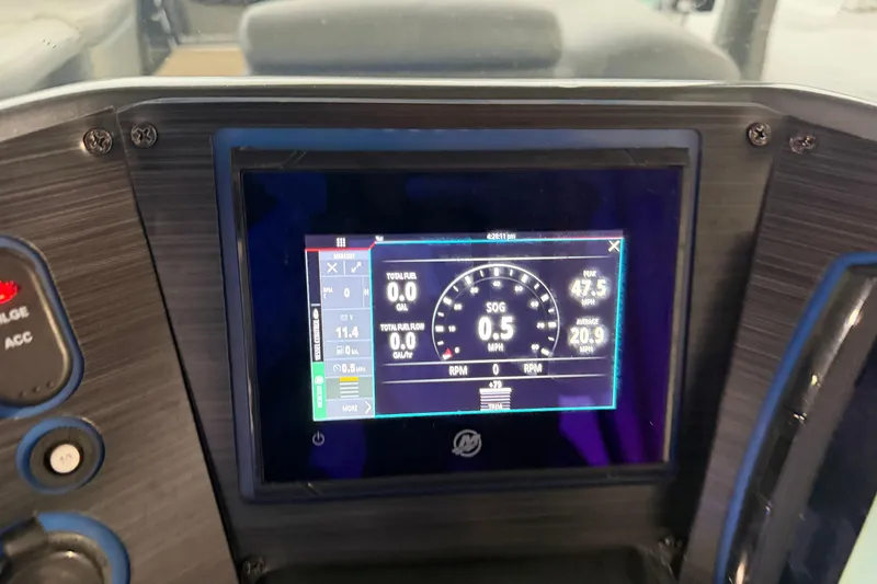 Slide: The Image of Dashboard of 2023 Aloha Pontoon PS 260 TT showing digital speedometer and fuel data. - 77