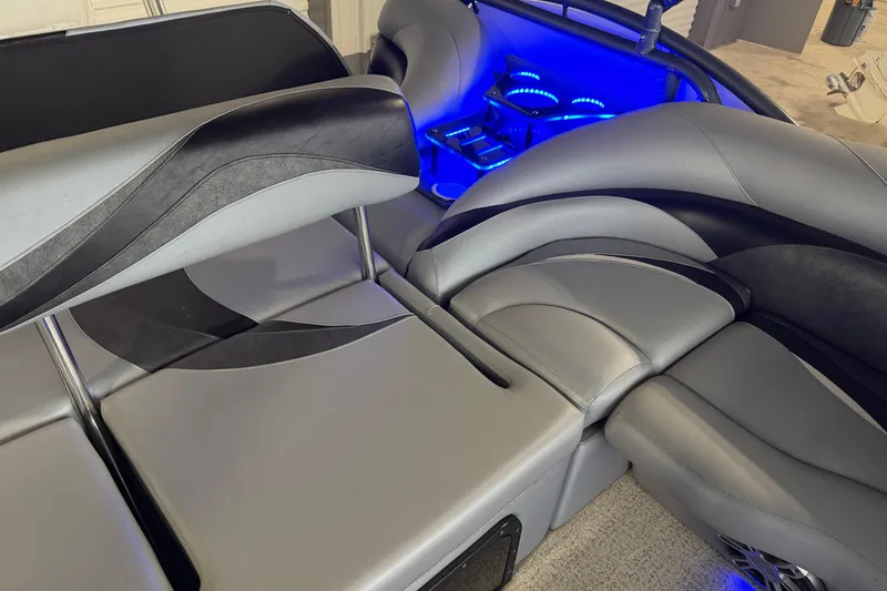 Slide: The Image of Luxurious interior of 2023 Aloha Pontoon PS 260 TT with blue LED lighting. - 80