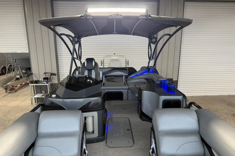 Slide: The Image of 2023 Aloha Pontoon PS 260 TT with sleek interior and ambient blue lighting. - 82