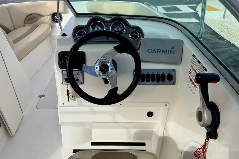 Slide: The Image of 2014 NauticStar 223DC Sport Deck boat dashboard with Garmin navigation system. - 15