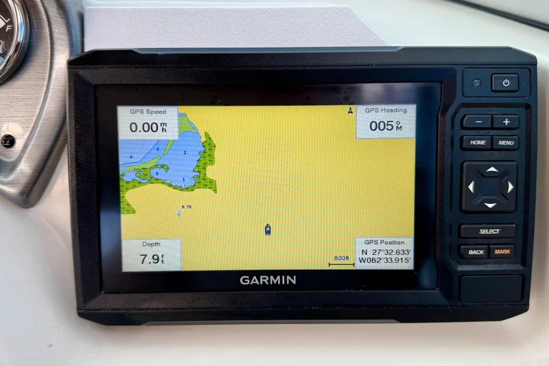 Slide: The Image of Garmin GPS display on 2014 NauticStar 223DC Sport Deck, showing map and navigation details. - 17