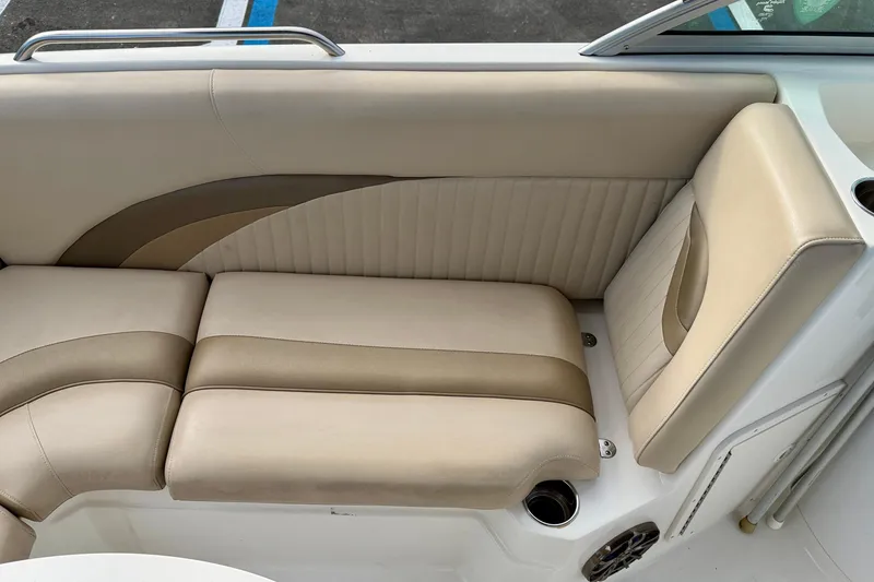 Slide: The Image of 2014 NauticStar 223DC Sport Deck boat interior seating, beige and tan upholstery. - 24