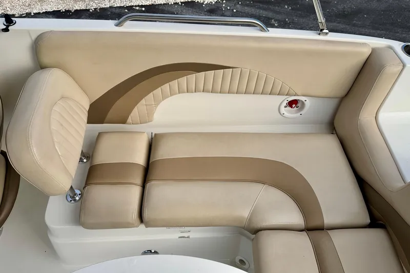 Slide: The Image of 2014 NauticStar 223DC Sport Deck boat interior with beige and brown seating. - 27