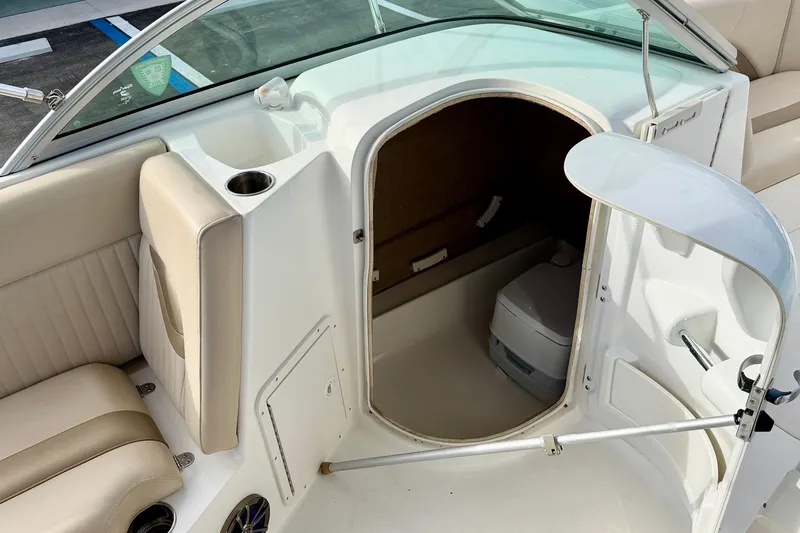 Slide: The Image of 2014 NauticStar 223DC Sport Deck boat interior with seating and storage area. - 40