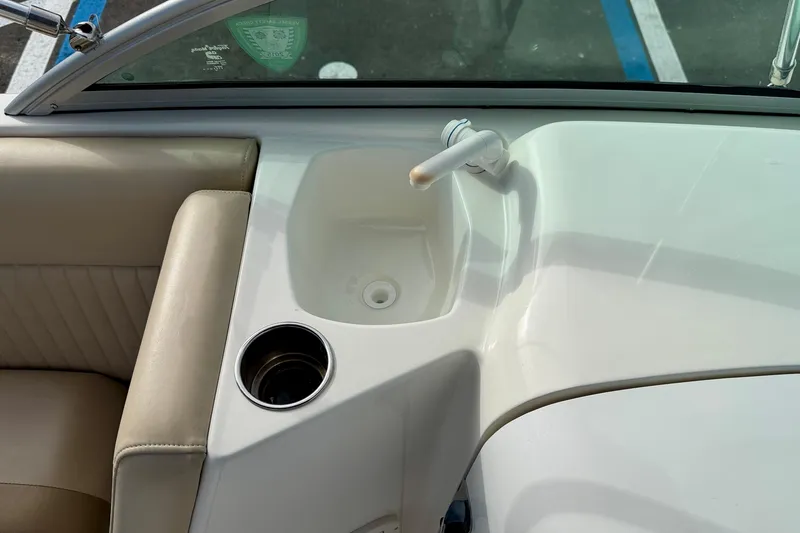 Slide: The Image of 2014 NauticStar 223DC Sport Deck interior with sink and cup holder. - 41