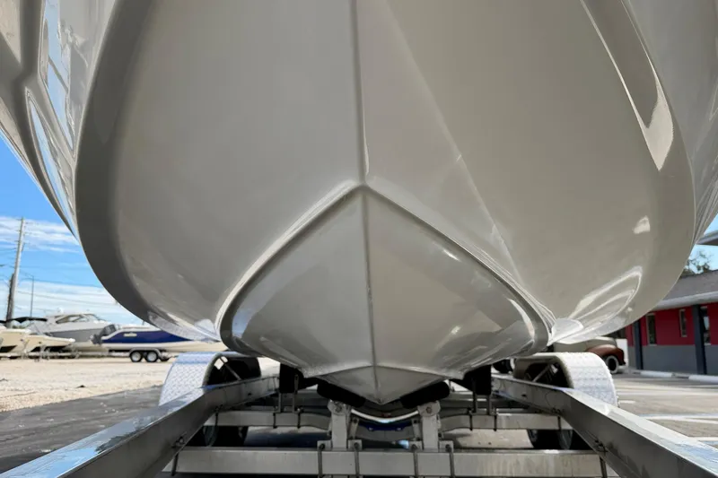 Slide: The Image of 2014 NauticStar 223DC Sport Deck boat on trailer, viewed from below. - 47
