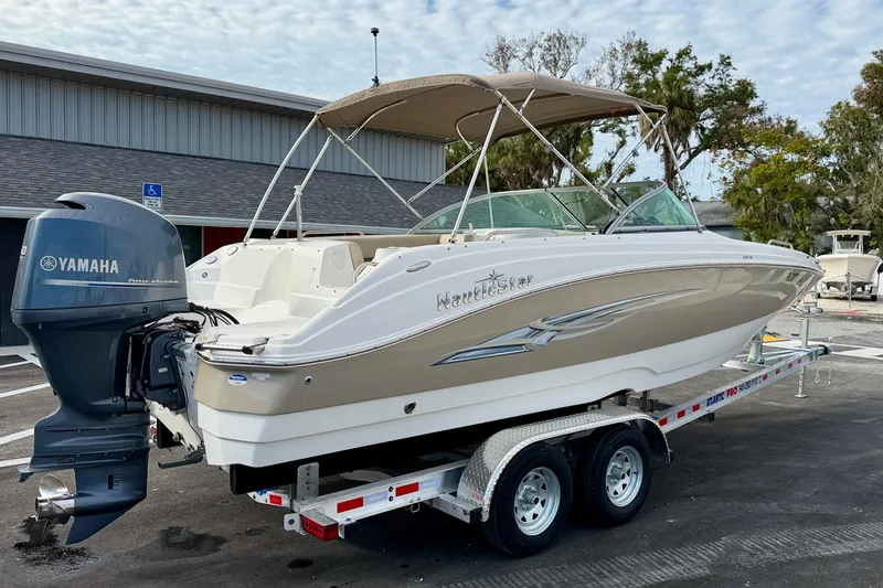 Slide: The Image of 2014 NauticStar 223DC Sport Deck boat on trailer with Yamaha outboard motor. - 7