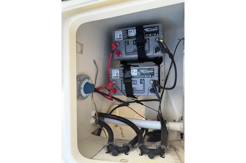 Slide: The Image of Battery compartment of a 2004 Holby Pilot 19 boat with NorthStar batteries. - 10