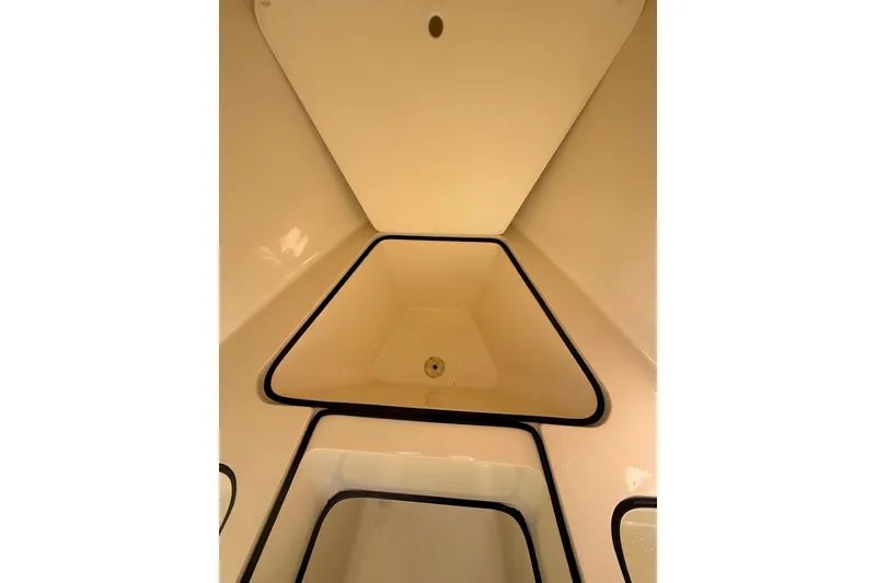 Slide: The Image of Interior view of 2004 Holby Pilot 19 boat, showcasing sleek, angular design. - 14