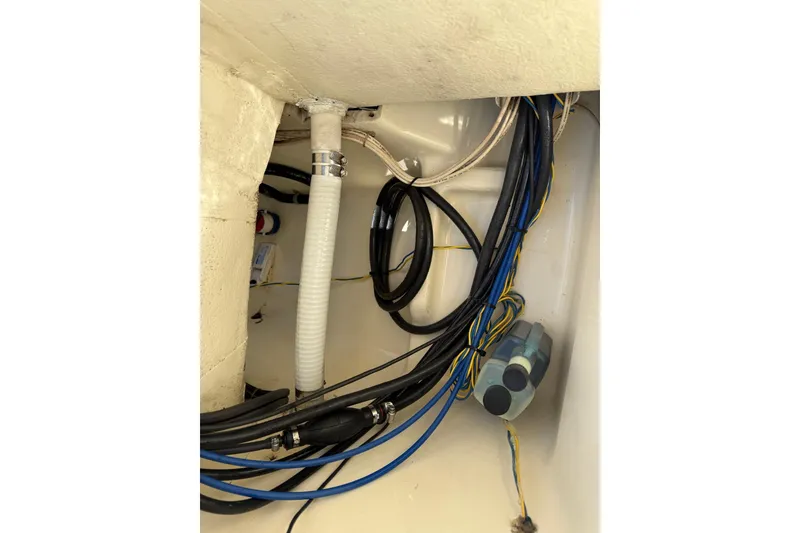 Slide: The Image of Interior wiring and hoses of a 2004 Holby Pilot 19 boat. - 8