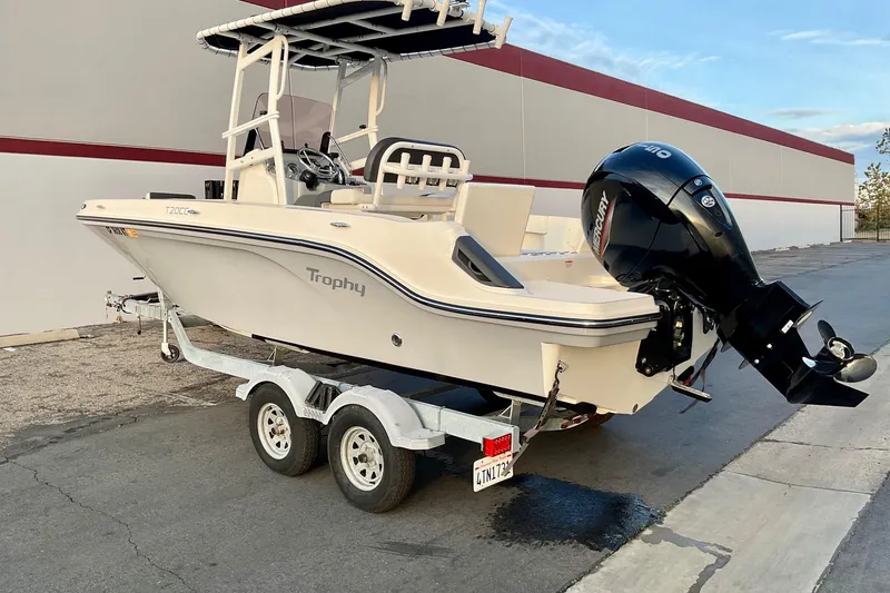 Slide: The Image of 2021 Bayliner Trophy T20CC boat on trailer with Mercury outboard motor. - 4