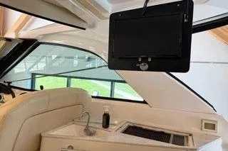 Slide: The Image of Interior of 2019 Regal 35 Sport Coupe with TV and kitchenette. - 16