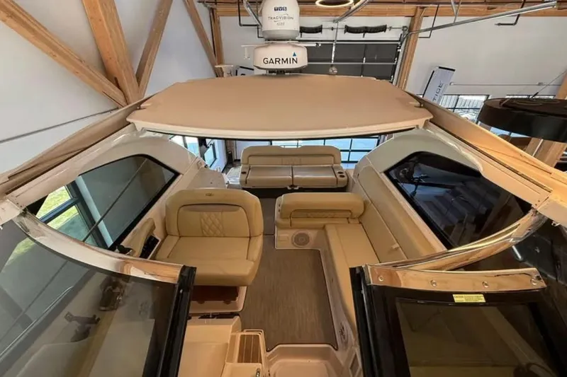 Slide: The Image of 2019 Regal 35 Sport Coupe interior with beige seating and Garmin equipment. - 19