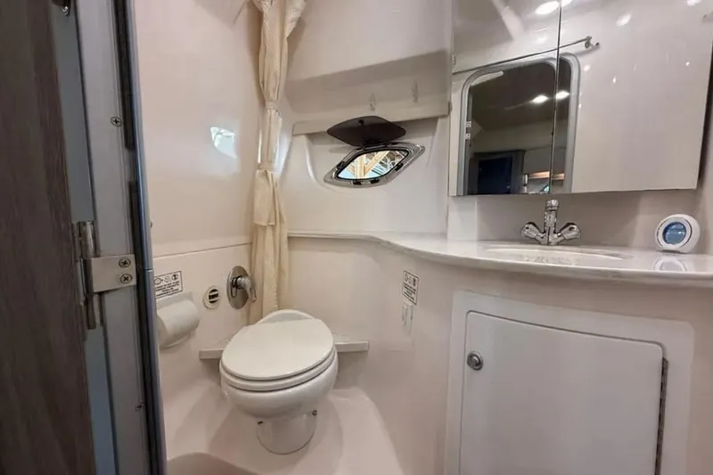 Slide: The Image of Bathroom interior of 2019 Regal 35 Sport Coupe with modern fixtures and mirror. - 22