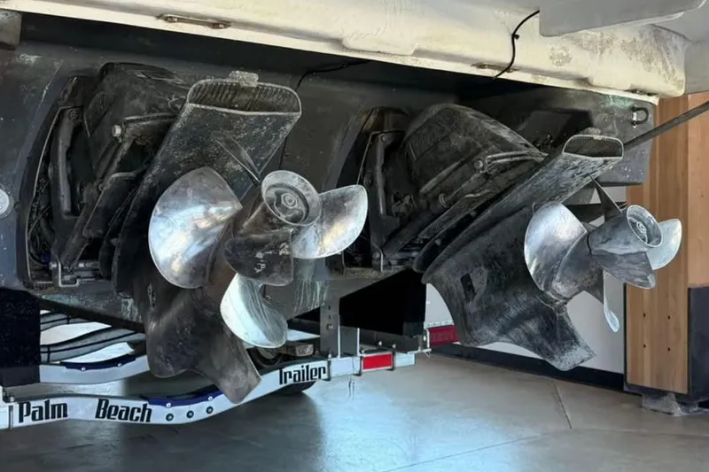 Slide: The Image of 2019 Regal 35 Sport Coupe boat propellers on trailer, close-up view. - 25