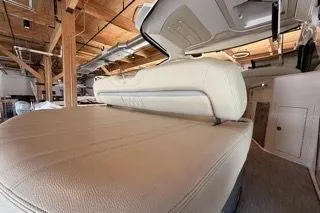 Slide: The Image of 2019 Regal 35 Sport Coupe interior with beige leather seating and modern design. - 7