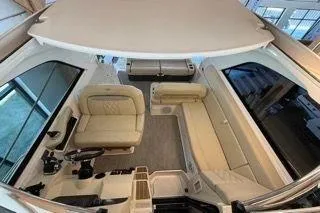 Slide: The Image of 2019 Regal 35 Sport Coupe interior with beige seating and modern controls. - 8