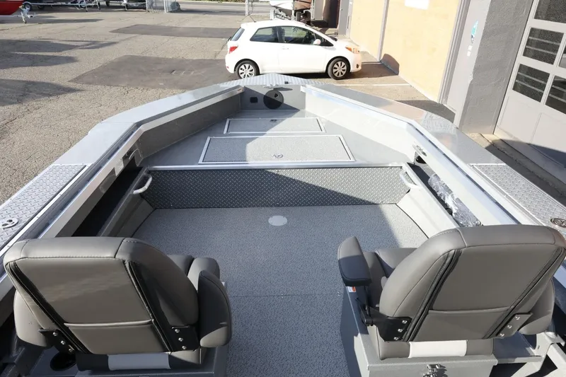 Slide: The Image of 2026 Thunder Jet 209 Rush OT boat interior with two seats and spacious deck. - 10