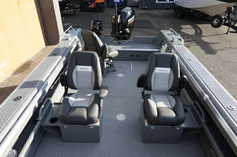 Slide: The Image of 2026 Thunder Jet 209 Rush OT boat interior with two seats and motor. - 14