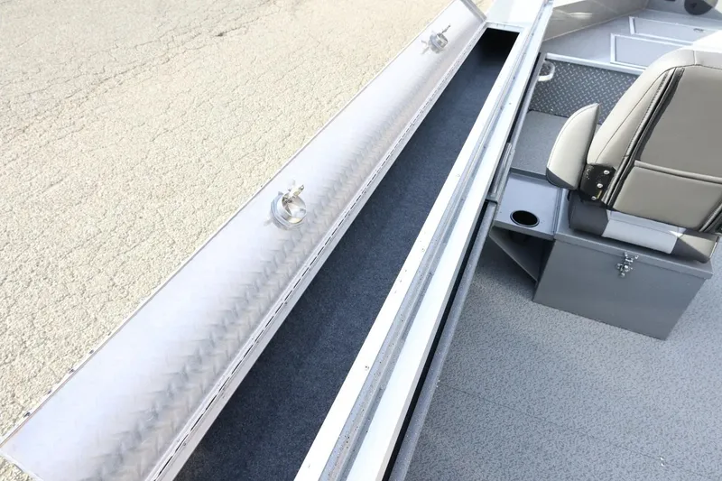 Slide: The Image of Interior view of 2026 Thunder Jet 209 Rush OT boat, featuring seating and storage compartments. - 15