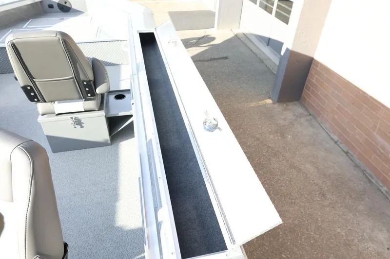 Slide: The Image of 2026 Thunder Jet 209 Rush OT boat interior with seating and storage compartment. - 16