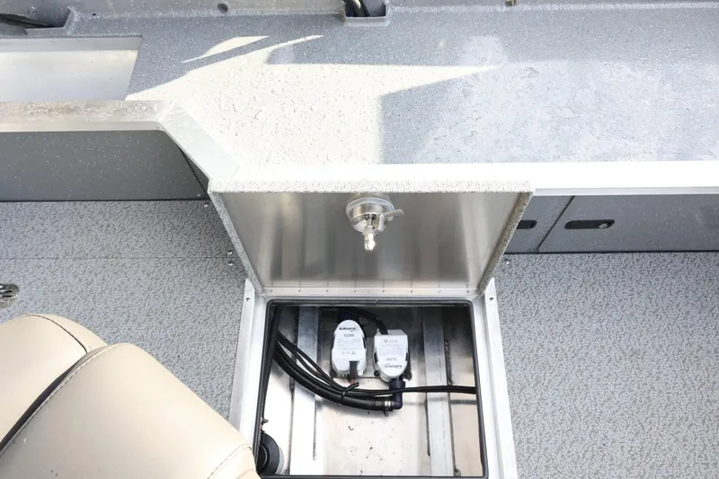 Slide: The Image of 2026 Thunder Jet 209 Rush OT boat interior with storage compartment and wiring. - 22