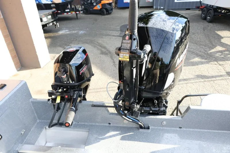 Slide: The Image of 2026 Thunder Jet 209 Rush OT boat with dual outboard motors. - 23