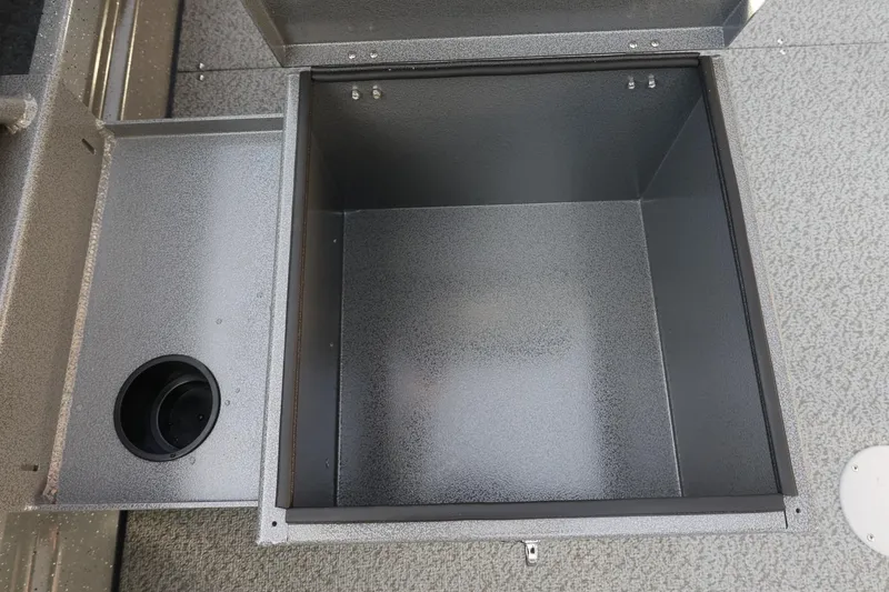 Slide: The Image of Open storage compartment in 2026 Thunder Jet 209 Rush OT boat. - 26