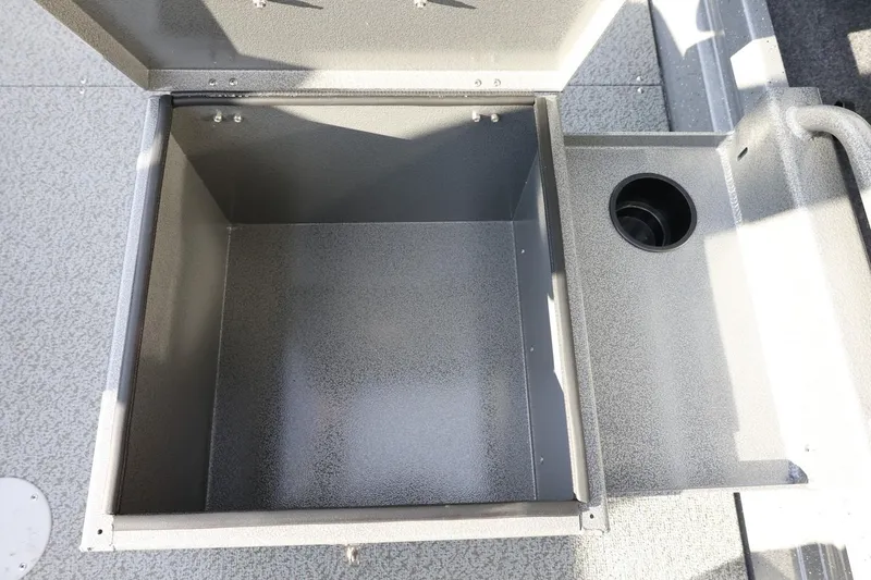Slide: The Image of Open storage compartment in 2026 Thunder Jet 209 Rush OT boat. - 27