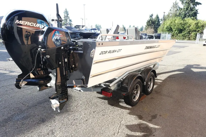 Slide: The Image of 2026 Thunder Jet 209 Rush OT boat with Mercury outboard engine on trailer. - 5