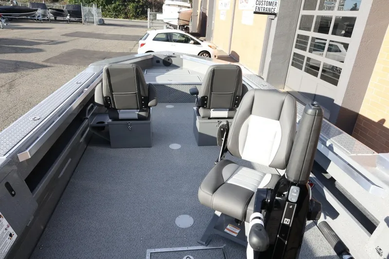 Slide: The Image of 2026 Thunder Jet 209 Rush OT boat interior with seating and controls. - 9